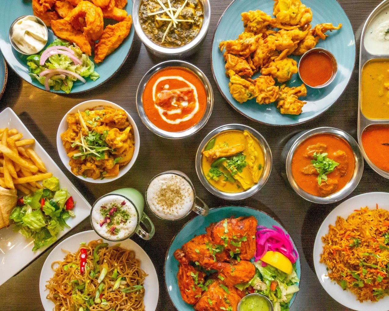 Contact Nosh Cafe Edmonton locations - Indian restaurant 109 Street 124 Street