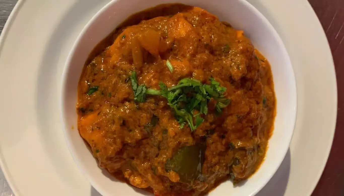 Chicken Tikka Masala at Nosh Cafe Edmonton - Classic Indian Dish